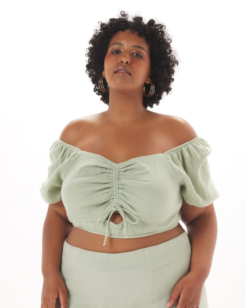 Front of a model wearing a size 1X Melanie Top in Sage in Sage Green by What Lo Wants. | dia_product_style_image_id:237921